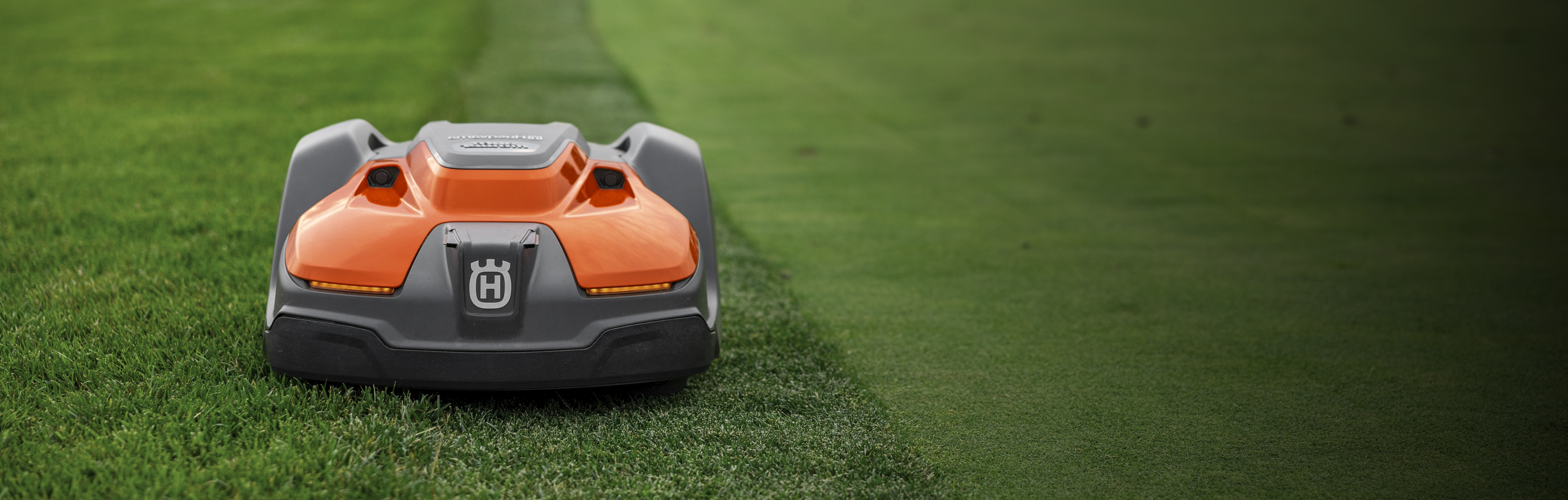 Husqvarna 550H Automower on a grassy field