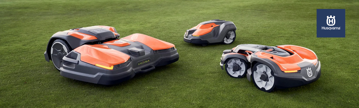 3 different models of Hugvarna Automower: CEORA, 550, 535 AWD on the green grass