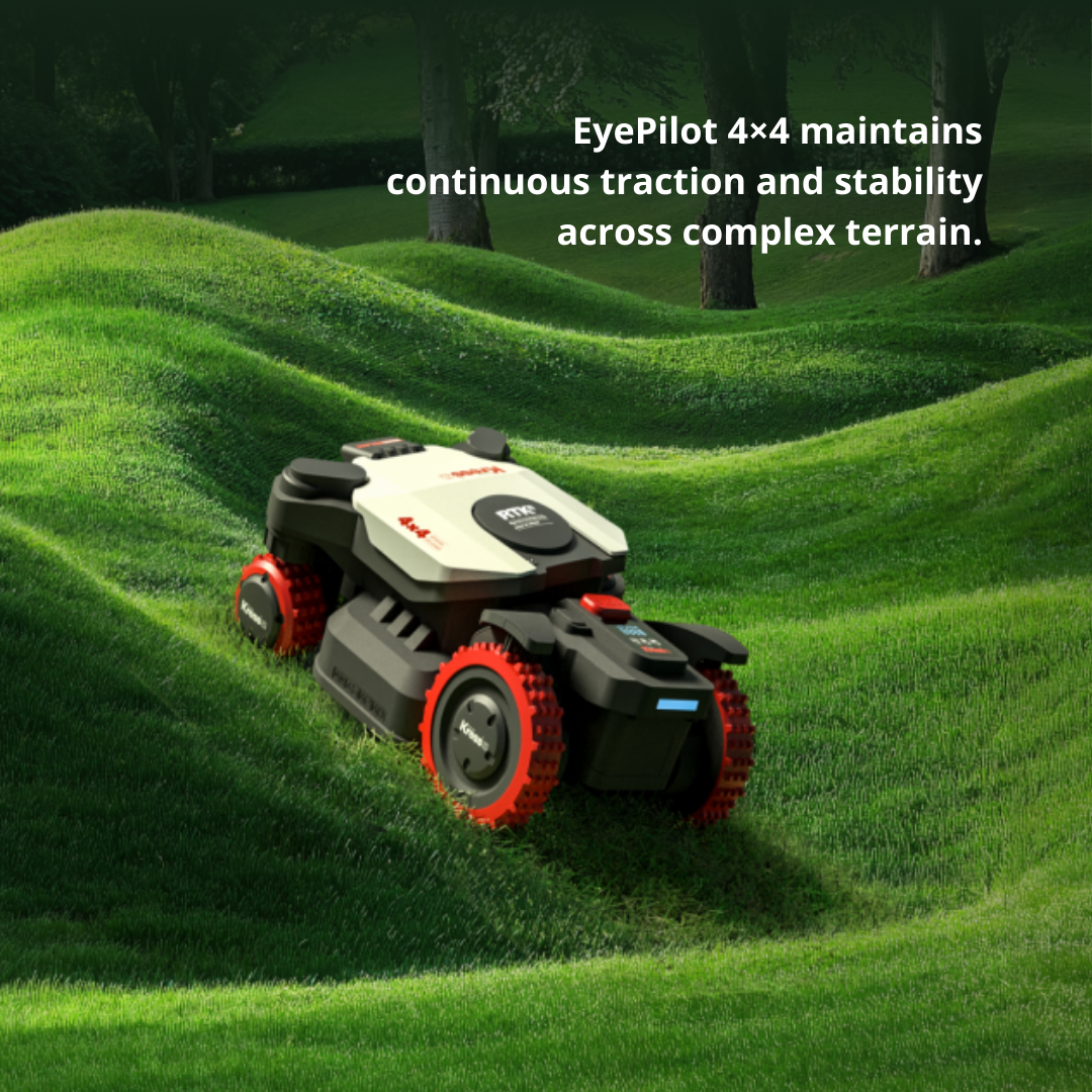 Robotic lawn mower on a well-maintained lawn with trees in the background